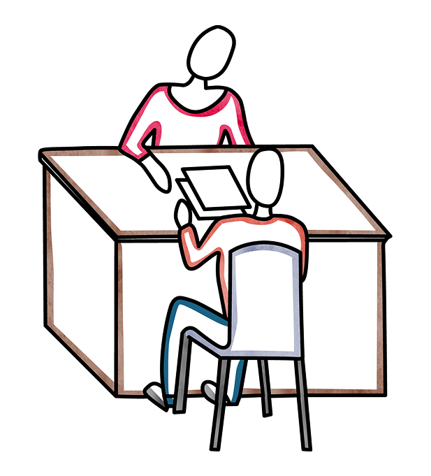 Two people discussing paperwork seated at a desk
